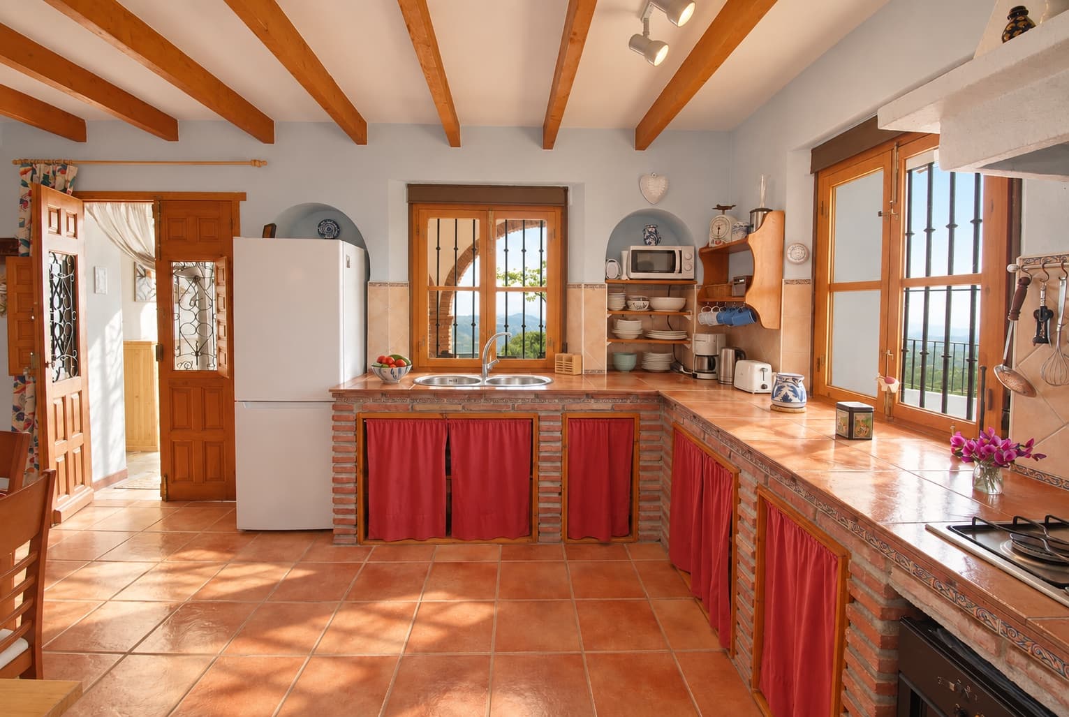 The country kitchen, a few steps from the terrace.