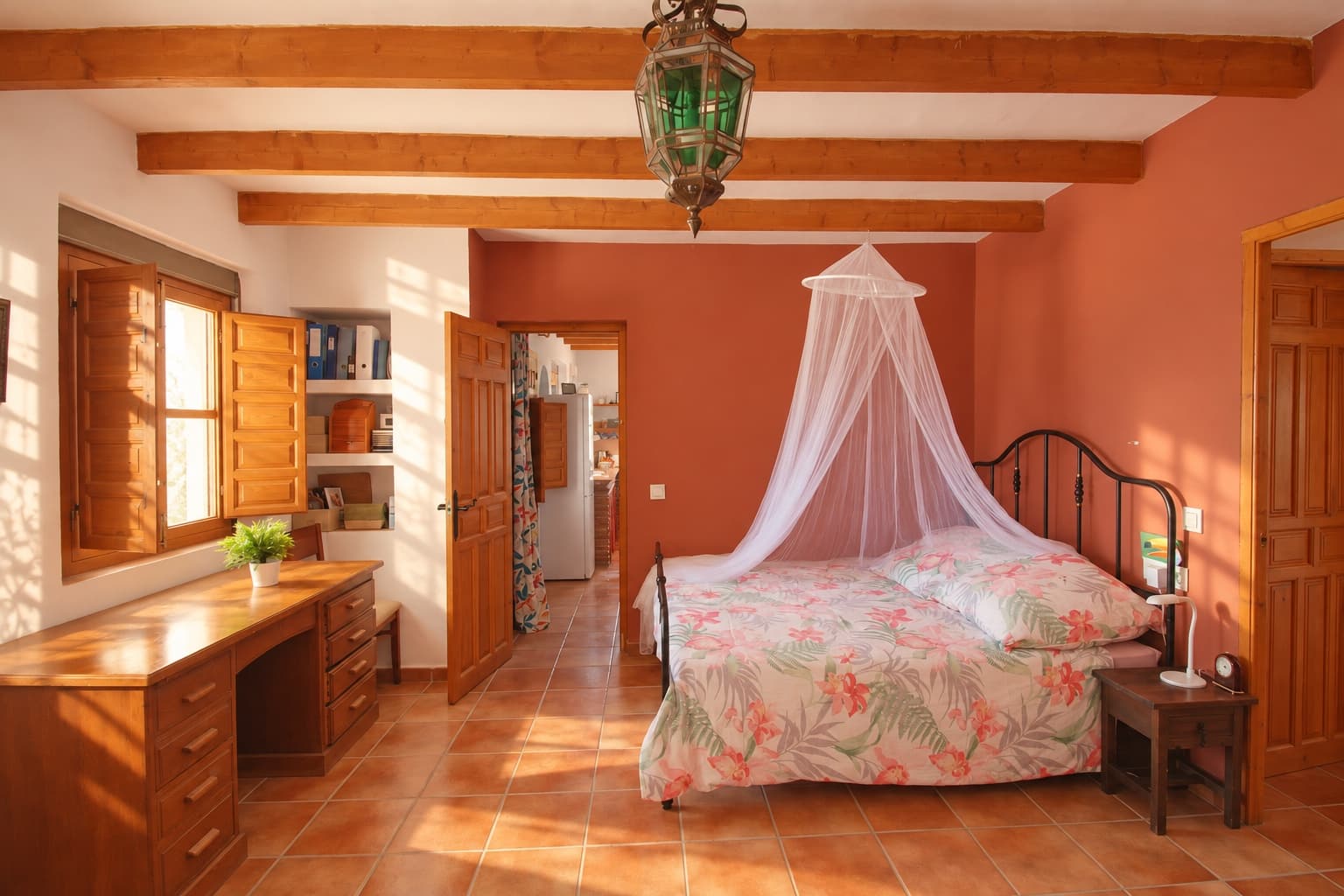 The first bedroom, with a desk by the window.