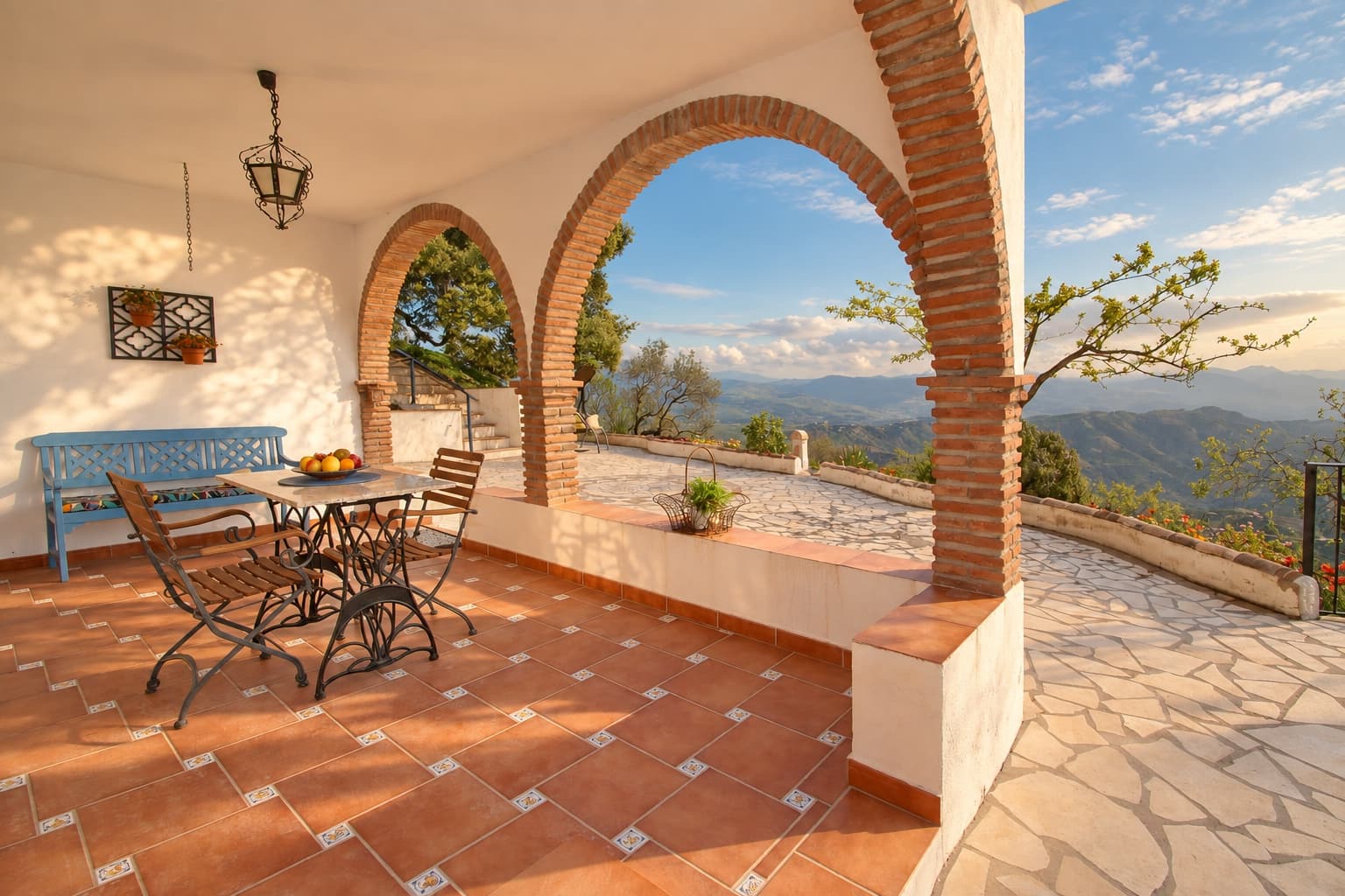 Shade on the covered terrace, with the Axarquía beyond.